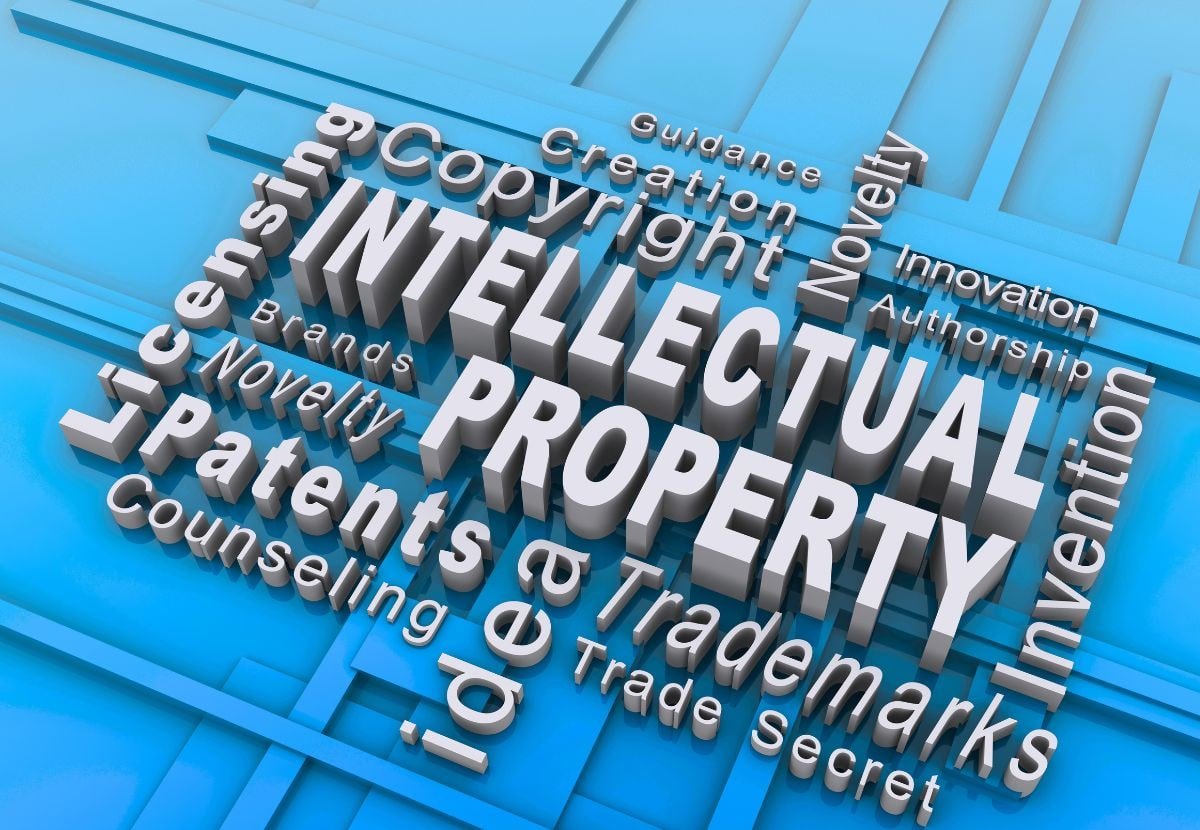 3D text reading Intellectual Property surrounded by patents, trademarks, and copyright terms